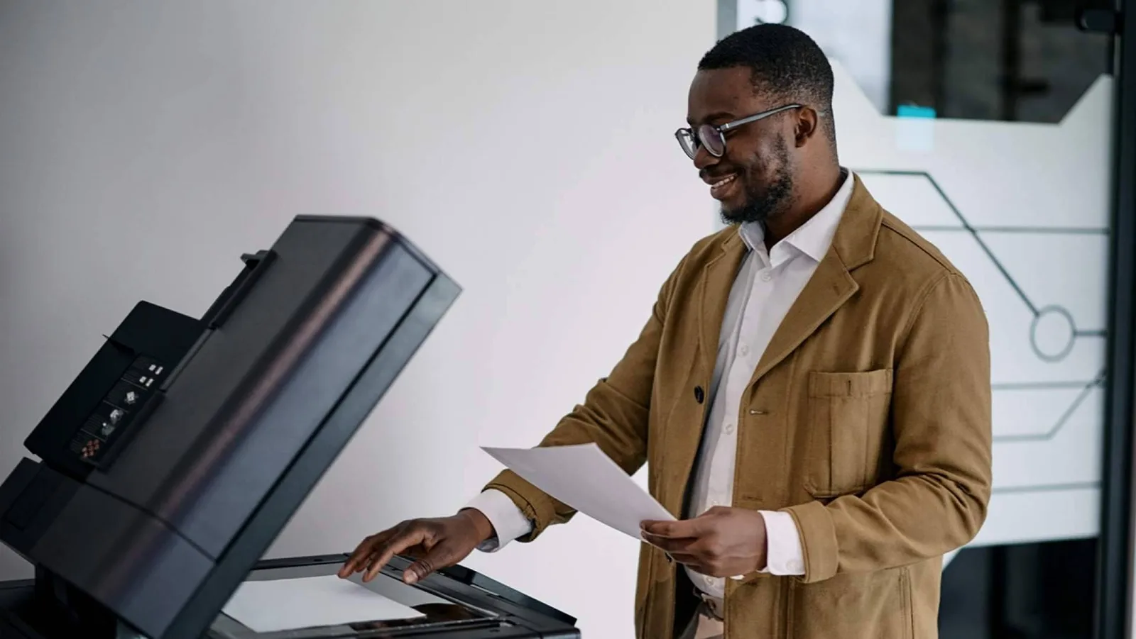 How can leasing a multifunction printer help reduce office costs?